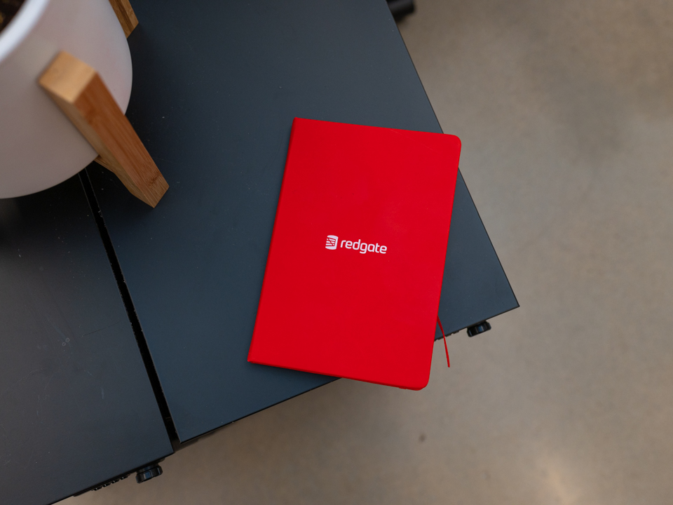 Redgate book on black table