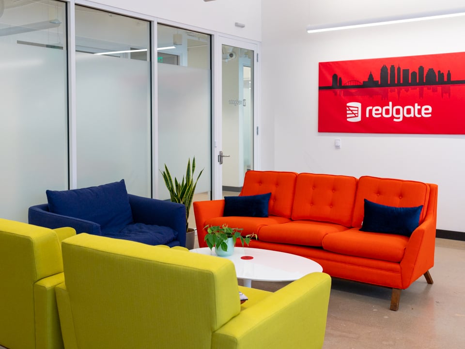 empty redgate office lounge with colored couches