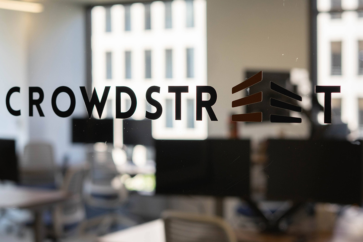 CrowdStreet logo on a glass door in the office