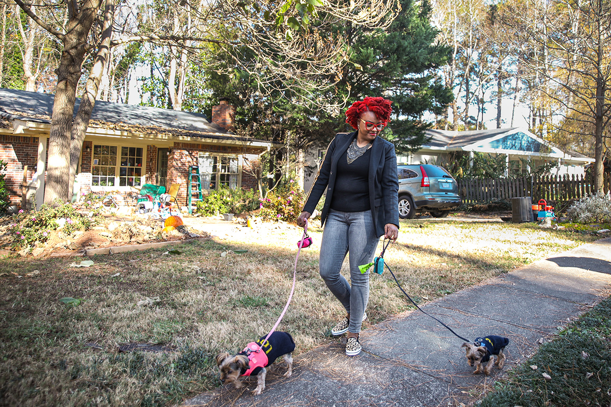 Dropbox team member Nicole Barton outside walking her dogs