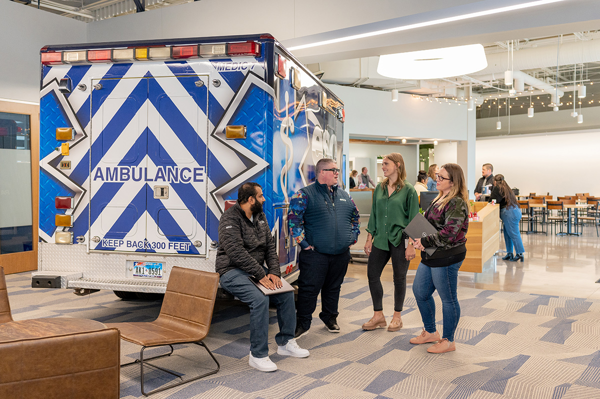ESO team members standing by a company branded ambulance