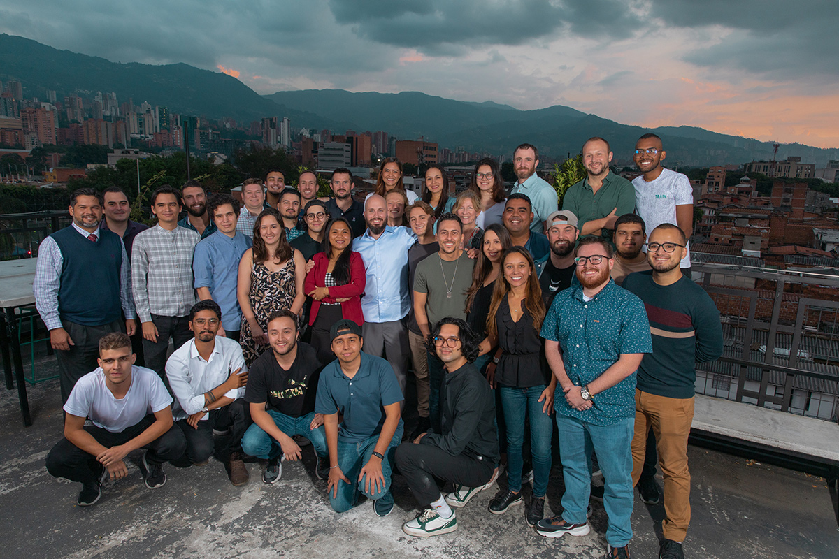 Lendflow group photo on a rooftop patio at dusk