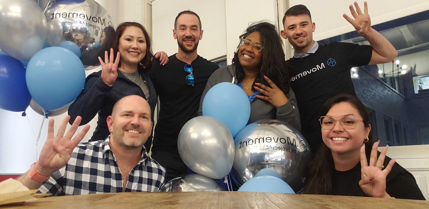 A group of project44 employees celebrate movement's release. 