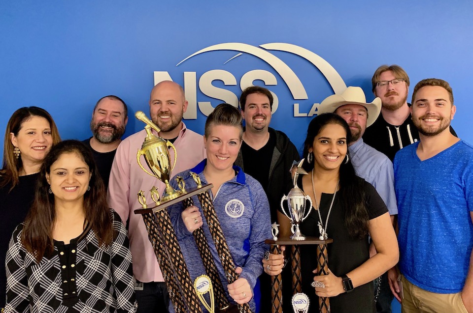 NSS Labs’s team members holding trophies