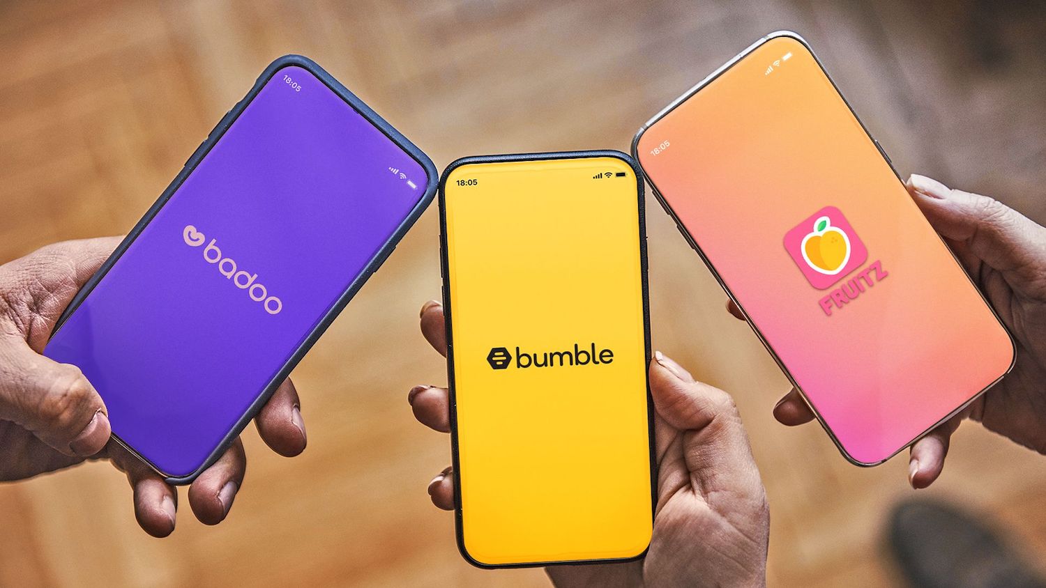 Three phones displaying the homepages of Badoo, Bumble and Fruitz