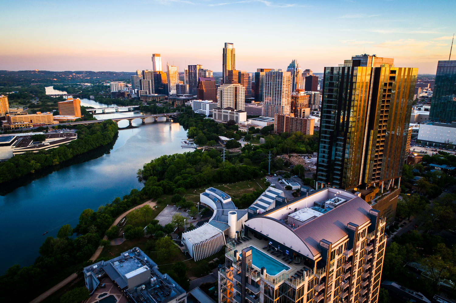 A view of downtown Austin from the river during sunrise.