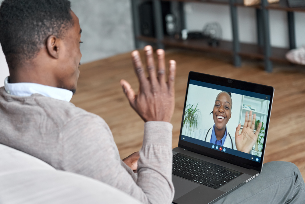 A patient meets with a therapist or doctor via a telehealth platform.