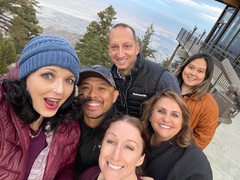 Small group selfie of Restaurant365 team members at an overlook