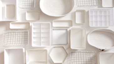 A flat lay photo of clean white storage objects 