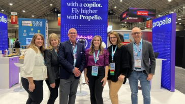 Members of the Propello team pose for a group photo at a convention.