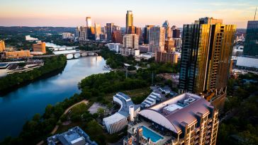 A view of downtown Austin from the river during sunrise.