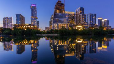 A nighttime photo of the Austin skyline.
